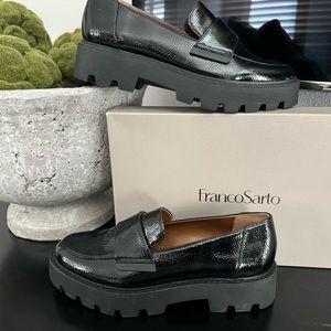 Brand new, never been worn black patent platform loafer, still in original box.